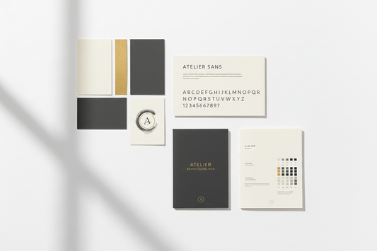 Brand identity system flat-lay with color swatches, typography specimen, and brand guidelines booklet