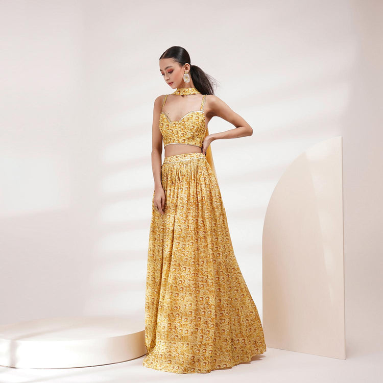 Model wearing a golden traditional dress for professional Ecommerce shoots with elegant lighting and minimal background